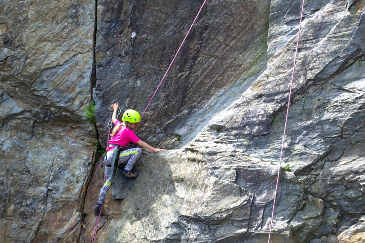 Girl rock climbing in France